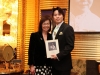 man holding Jean Lumb plaque posing for photo next to foundation president