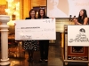 two women onstage holding giant size check to Jean Lumb foundation from Laifun designs