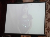 projection screen showing young women talking