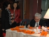 chinese calligrapher writes guest names on scrolls