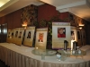 photos of Jean Lumb alumni displayed on long table
