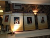photos of Jean Lumb alumni displayed on long table