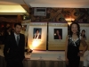 photos of Jean Lumb alumni displayed on long table