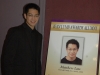 Jean Lumb alumnus posing next to his protrait