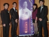 Four student award recipients posing next to Jean Lumb banner