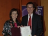 Hon. Michael Chan presents award to Arlene Chan