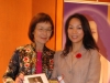 Arlene Chan handing award to event sponsor