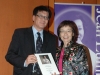 Arlene Chan handing award to event sponsor