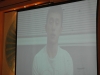 projector screen with photo of Patrick Chan