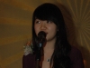 student speaking into microphone