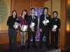 2013 award recipients holding their awards onstage