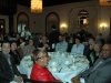 Large rception room full of guests seated at tables