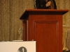 women speaking behind podium