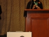 women speaking behind podium