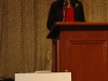 women speaking behind podium