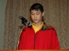 Man speaking behind podium