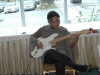 Musician playing electric guitar.