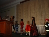 Little children dressed up in Halloween costumes .