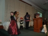 Little children dressed up in Halloween costumes .