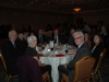 Large banquet hall with guests seated at dinner tables