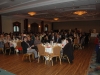 Large banquet hall with guests seated at dinner tables