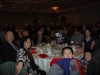 Large banquet hall with guests seated at dinner tables