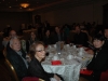 Large banquet hall with guests seated at dinner tables
