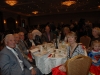 Large banquet hall with guests seated at dinner tables