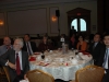 Large banquet hall with guests seated at dinner tables