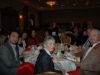 Large banquet hall with guests seated at dinner tables
