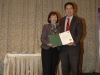 two people standing together holding certificate