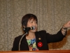 women speaking behind mircrophone