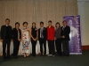 Group standing together beside Jean Lumb banner