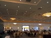 Banquet hall with dinner guests and presentation stage with Jean Lumb foundation logo.