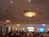 Banquet hall with dinner guests and presentation stage with Jean Lumb foundation logo.