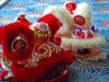 Chinese dragon masks with fluffy and shiny red and white materials.