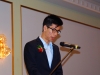 Man speaking into micrphone.