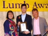 Student holding their award.