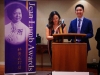 Co-emcees speaking behind podium.