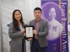 two people holding Jean Lumb award plaque.